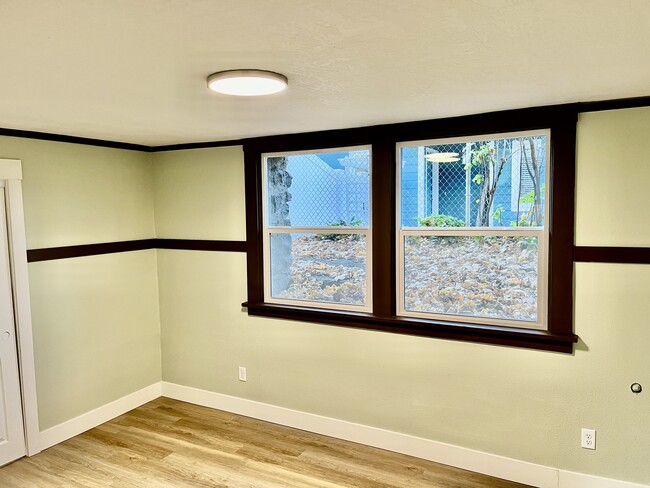 Bedroom with giant (insulated) windows and more trim rail. - 1401 W 13th Ave