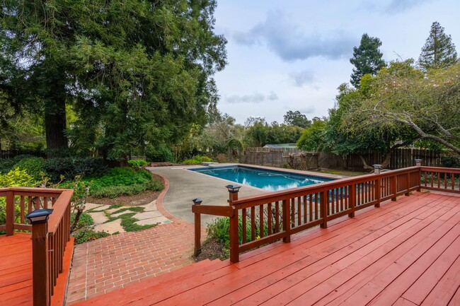 Building Photo - Gated 4-Bedroom 3 Bath Home with Pool in B...