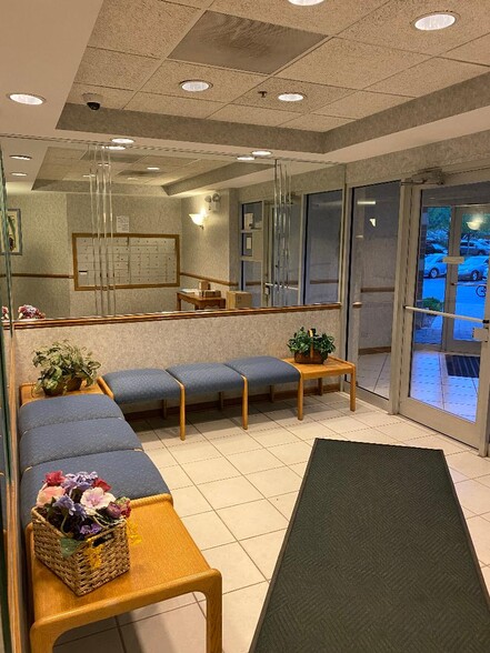 Buzz in guests through lobby - 6400 W Berteau Ave
