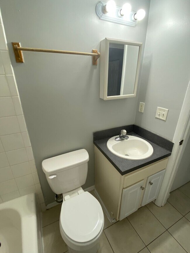 Building Photo - Beautiful 2/1B all tiled 2nd floor condo i...