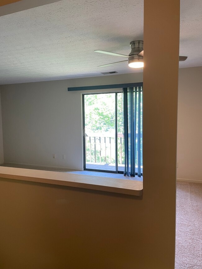 View from Kitchen into Dining Room/Living Room - 7230 Creekview Dr