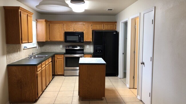 Building Photo - NEW FLOORING - AVAILABLE NOW!