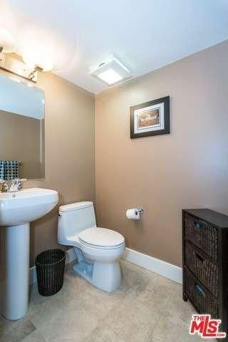 Half bathroom after entryway - 1951 N Beachwood Dr