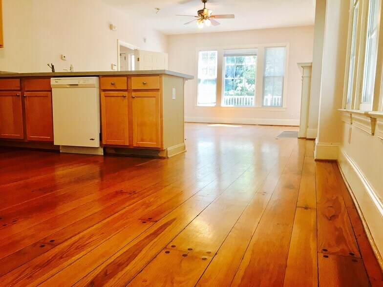 Kitchen with modern appliances, natural light, and open flow to dining and living. - 1937 Fairfield Dr