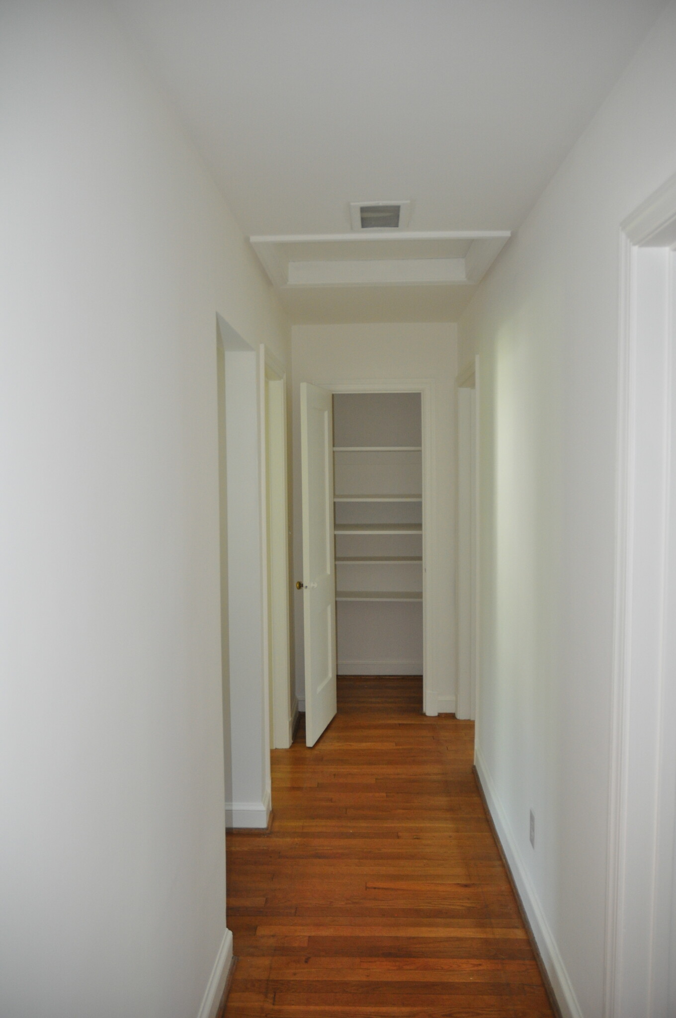 Hallway to bedrooms and upstairs bath with two linen closets - 5404 Wilson Ln