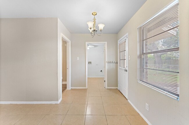 Building Photo - Beautifully remodeled 4 bedroom bath and a half with ceramic tile through out and laminate floori...