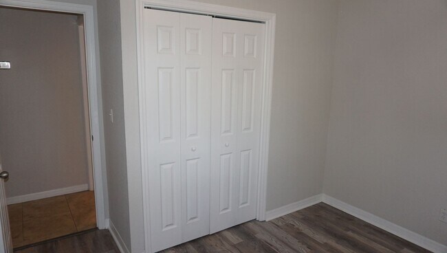 Building Photo - Four Bed - Three Bath - Large Storage Area...