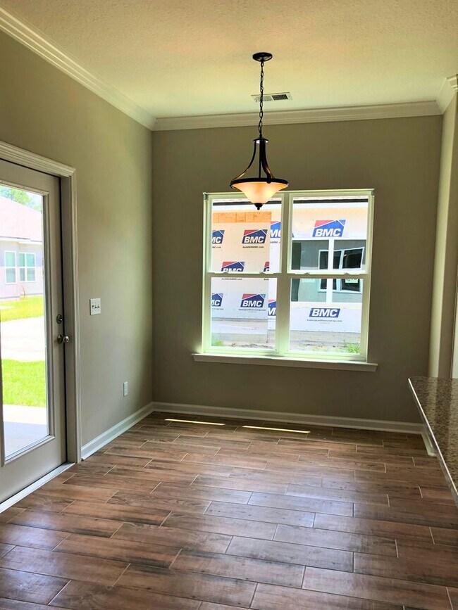 Building Photo - 3/2 with landscaping included!