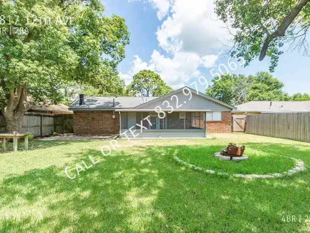 Backyard with pit and screened covered patio - 2817 12th Ave N