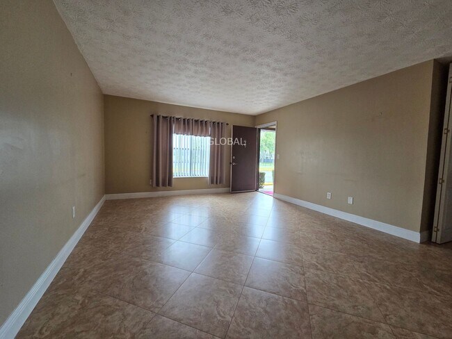 Building Photo - Lakefront First-Floor Condo in Camelot by ...