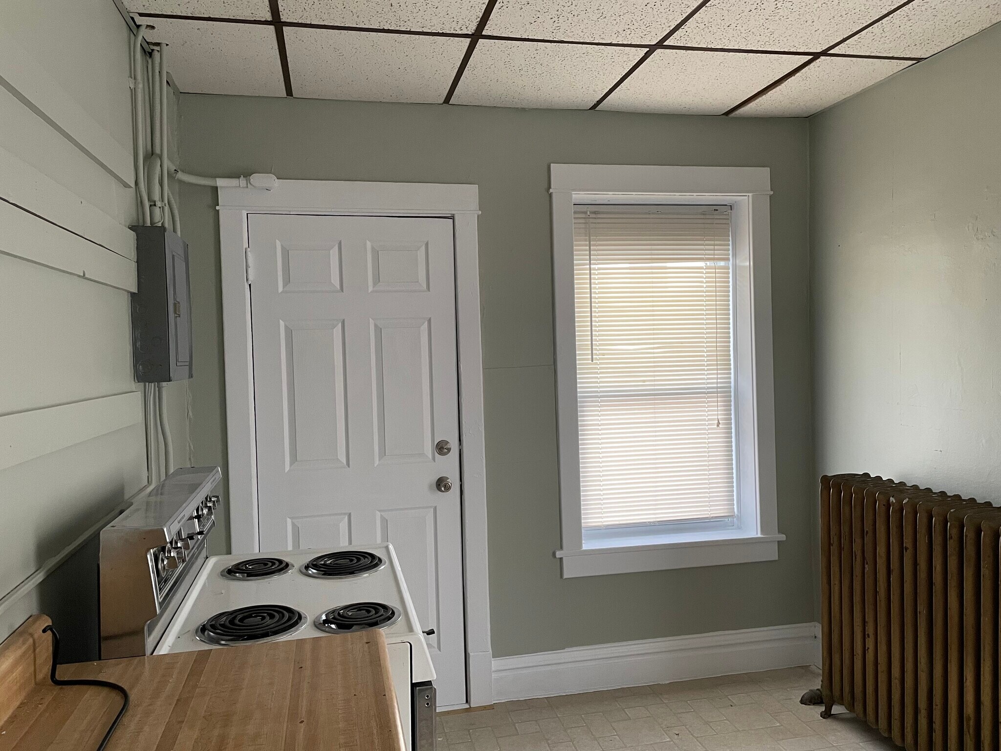 Kitchen with new upper cabinets coming soon - 432 E 7th St