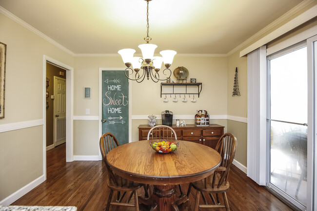 Photo 12. Open plan Dining Room with green Pantry Door - 1623 Lethia Dr