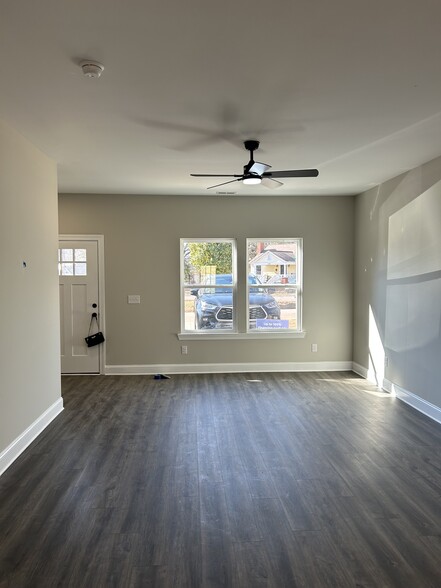 Great room: luxury plank flooring, ceiling fan, natural light - 334 Bailey St