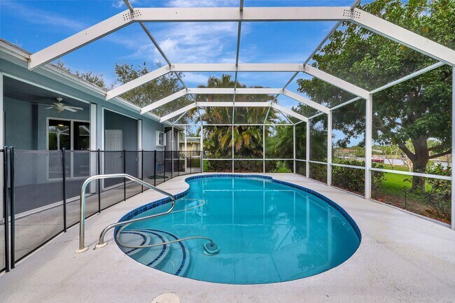 Building Photo - A BOATER'S PARADISE WITH THIS STUNNING 3 BEDROOM, 2 BATH WATERFRONT POOL HOME W/DOCK & BOAT LIFT ...
