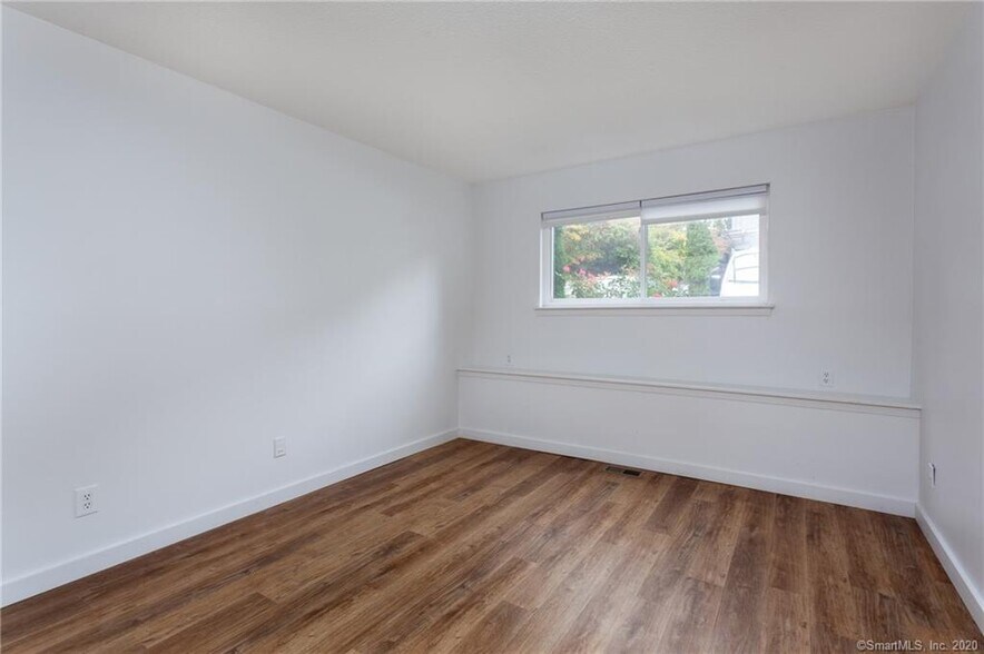 Spacious bedroom comfortably fits a king bed - 188 Flax Hill Rd