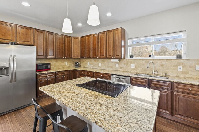 Building Photo - Spacious Home with Finished Basement, Granite Kitchen & Fenced Yard Near Fort Carson