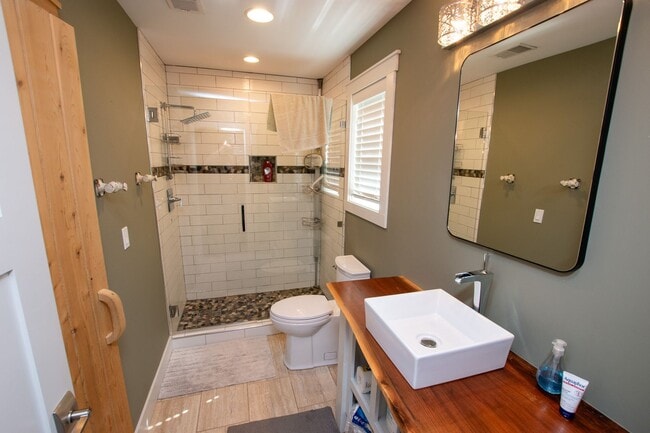 Building Photo - Experience Elevated Living with West Bay V...