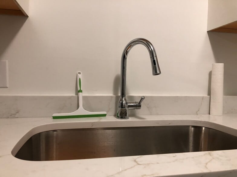 Updated kitchen sink with new faucet and counter. - 261 Simpson Ave