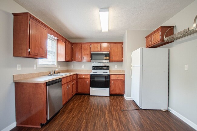 Building Photo - Pet Friendly with Fenced Yard!