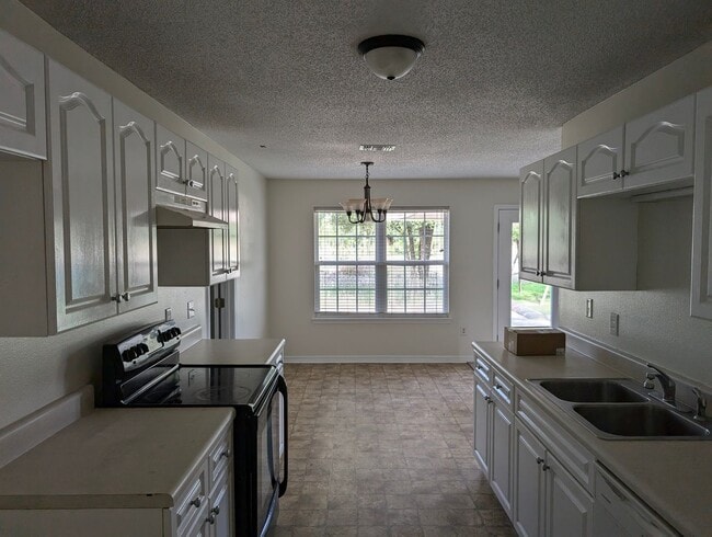 Building Photo - Updated 4-Bedroom Home on a Quiet Street — 1,695 sq ft, Large Garage — Now Accepting Applications