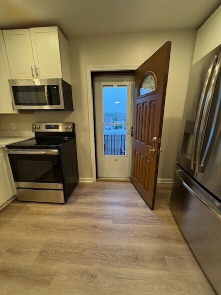 Kitchen with door to outside deck - 9 E Union Blvd
