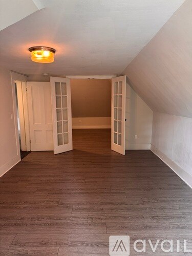 3rd floor sitting area with bedroom through the french doors. - 142 Central Ave