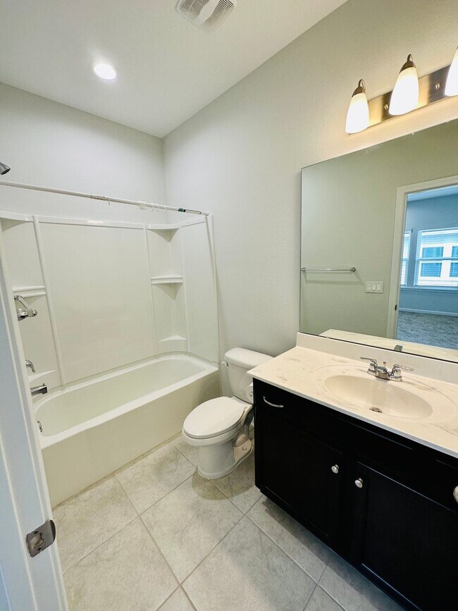 Building Photo - Spacious End Unit with Garage & Loft. Community features High End Amenities!