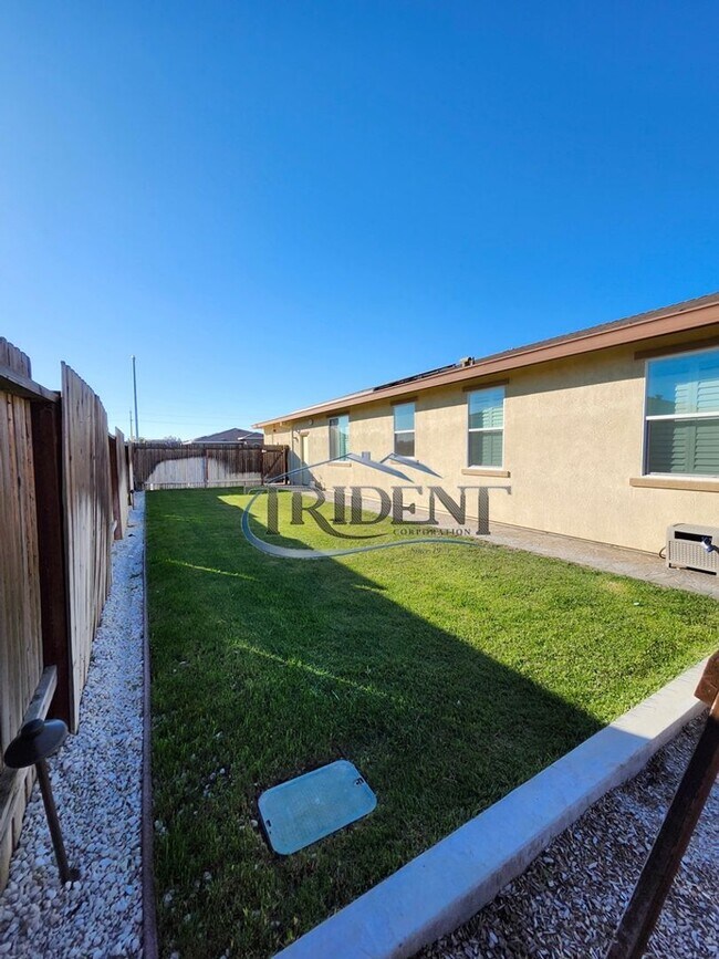 Building Photo - Updated home with a built in BBQ and play area