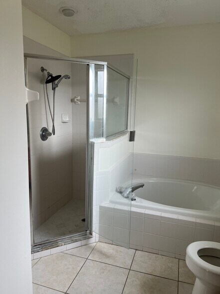 The master bath features a relaxing garden tub and dual sinks — perfect for a couple. - 5374 Lacy Jane Way