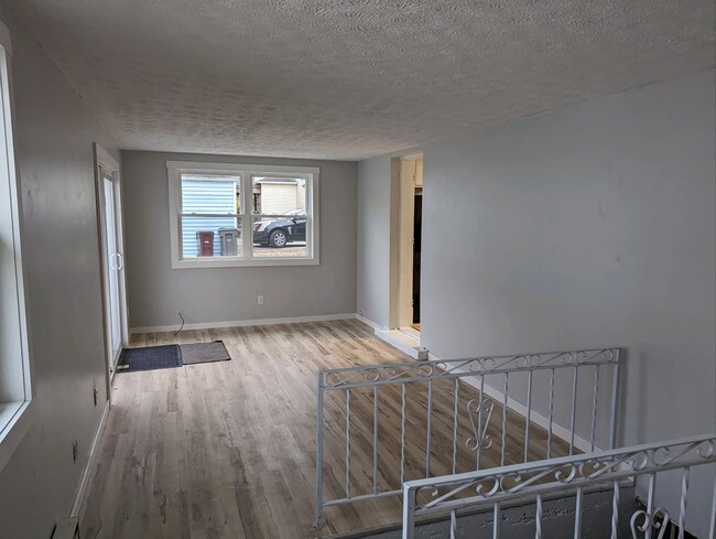 living room with sliding patio door - 834 N Elizabeth St