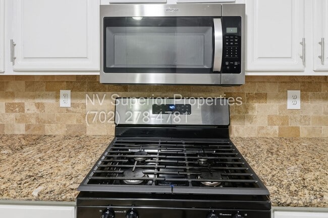 Building Photo - SW!!! 2 Bedroom Condo 1st Floor!! 2 Garage!! Gated!! Community Pool!! Fitness Room!! 2 Primary Be...