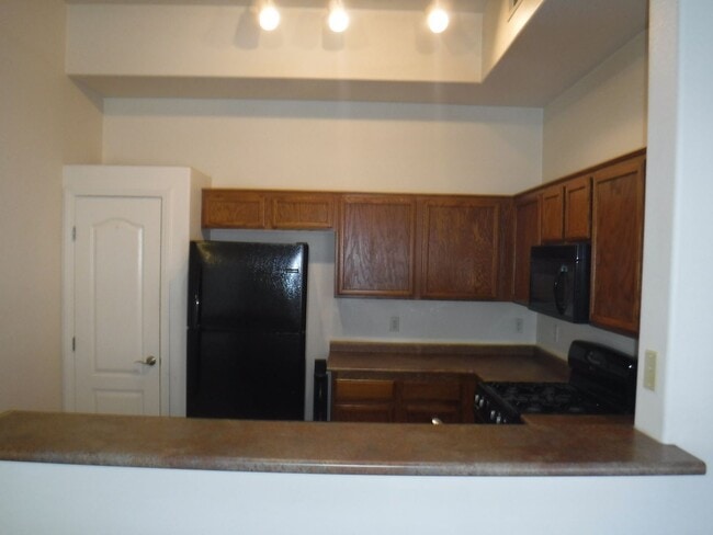 Building Photo - SECOND STORY CONDO IN GATED COMMUNITY WITH...