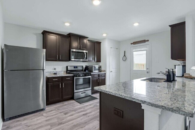 Building Photo - ASK ABOUT FREE APPLICATION FEES THROUGH AUGUST!  PRICE REDUCED!! Landscaping Included! Charming 3...