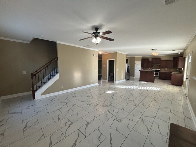 Building Photo - This property blends ample living space and storage with functional amenities.