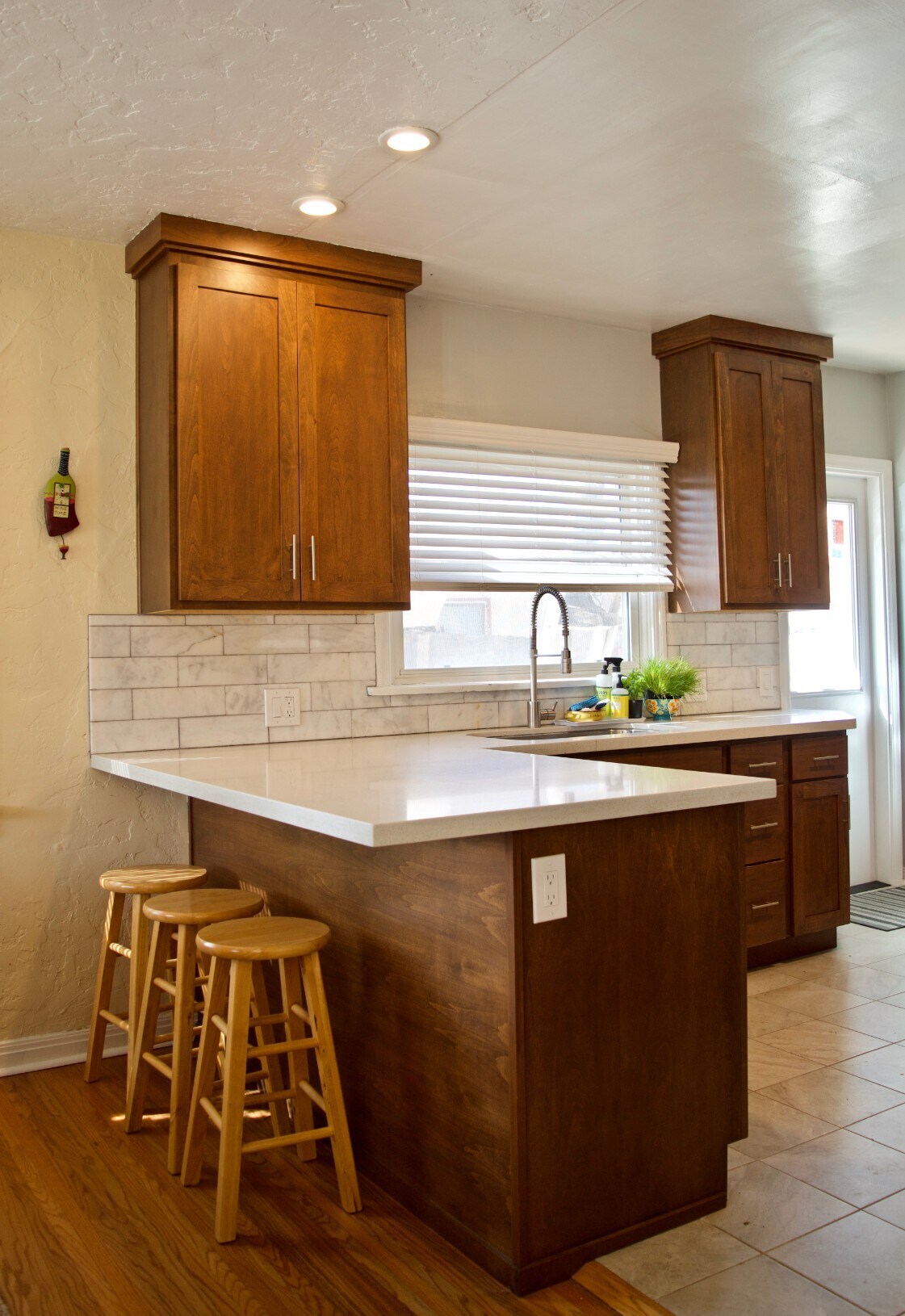 custom cabinets, quartz countertops and marble backsplash - 4770 Bancroft St