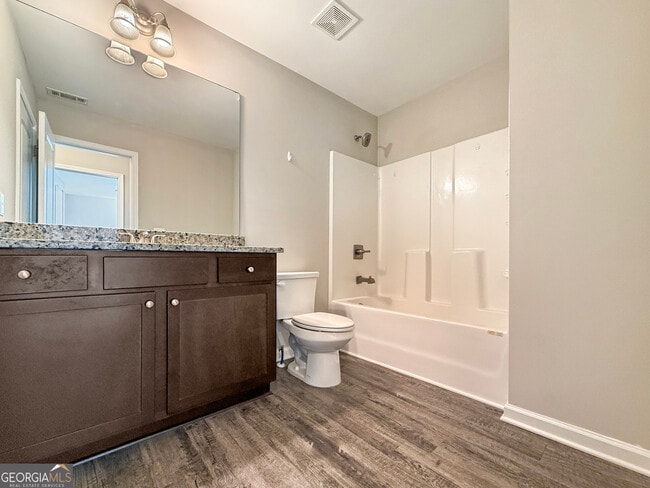 Building Photo - 6369 Woodland Station Dr