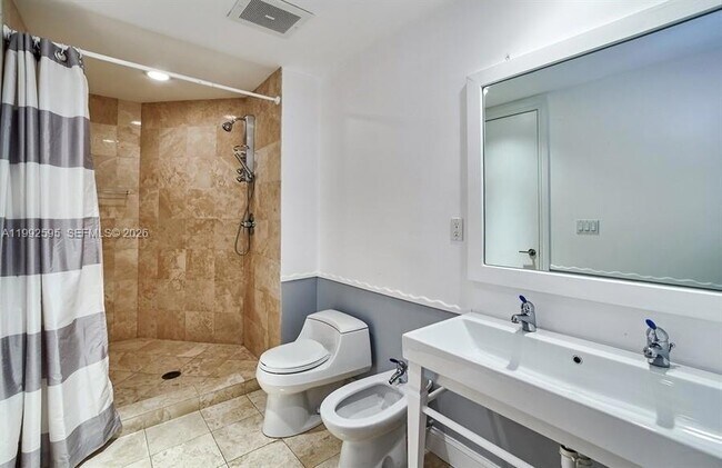 Building Photo - 10225 Collins Ave