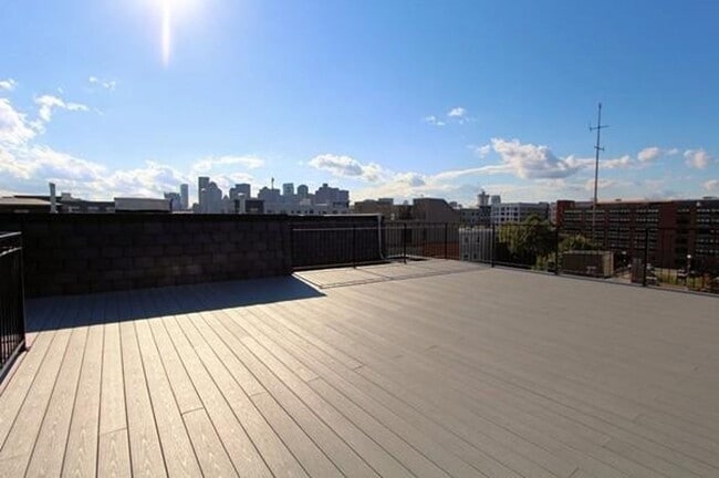 Building Photo - Room Available in Modern 2BR Condo – Jeffr...