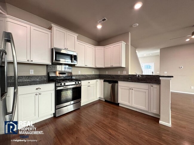 Building Photo - Spacious 4-Bedroom Home with Fenced Yard & 2-Car Garage Near JBLM!