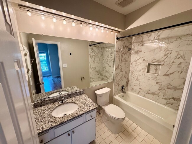 Building Photo - Top-Floor End Unit Condo at New Bern Place