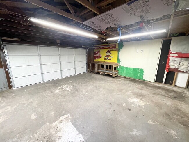 Building Photo - 3 Bedroom Home  with huge, 2-car garage/workshop combo (has electricity)