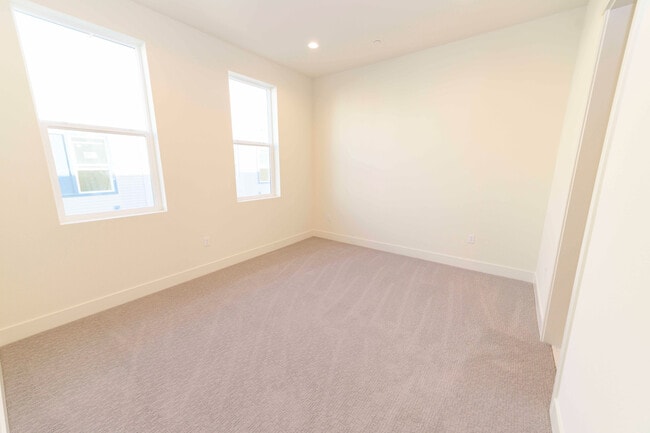 Building Photo - Experience contemporary urban living at its finest. Private Garage & Dual Suites!
