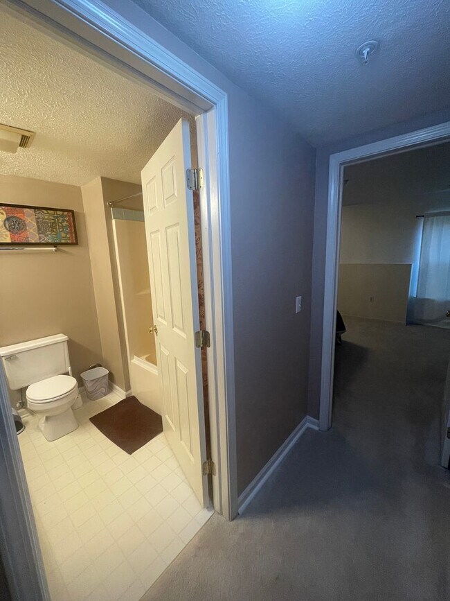 Building Photo - 2 Bed + Office Condo | Pool, Garage & Flexible Move-In