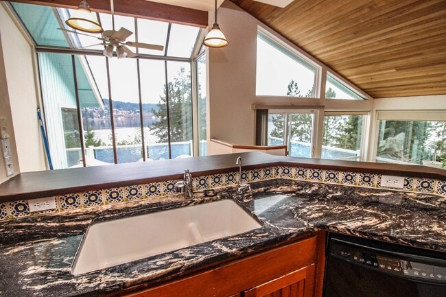 Building Photo - Spacious 4-Bedroom Home with Stunning Lake...