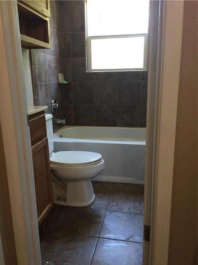 Building Photo - Remodeled 1 story home in Hurst with original plank wood flooring