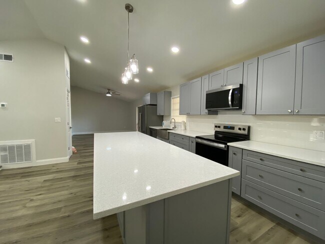 Building Photo - Totally refurbished three bedroom, two bat...