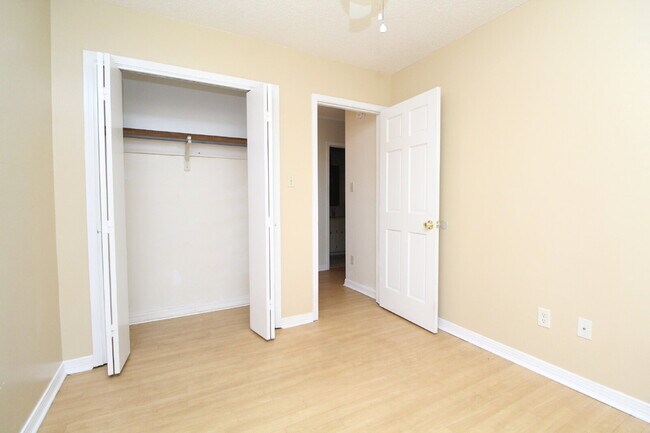 Building Photo - 2BR Home with Wood-Look Flooring, Fenced Backyard & Private Patio