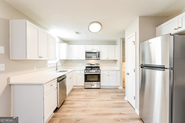 Building Photo - 5767 Riverside Dr