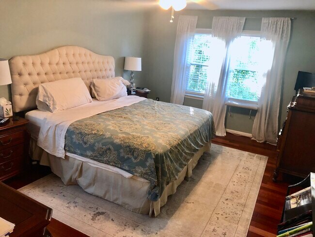 Primary bedroom with hardwood floors - 120 Connemara Dr