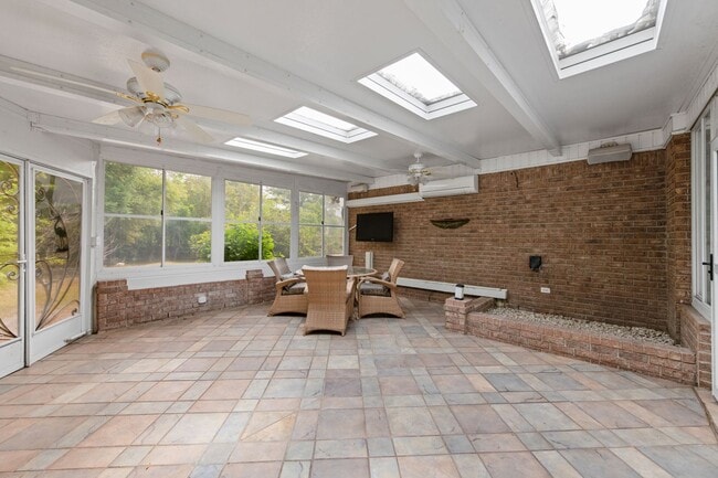 Building Photo - Spacious 3BR Retreat with Soaring Ceilings & Screened Porch